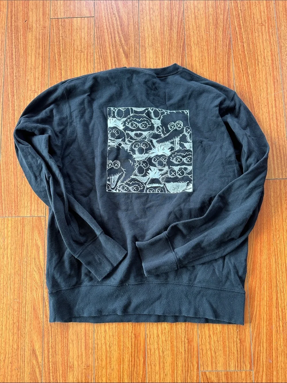 Uniqlo x KAWS Men’s Black Crewneck Sweatshirt with White XX Stitch